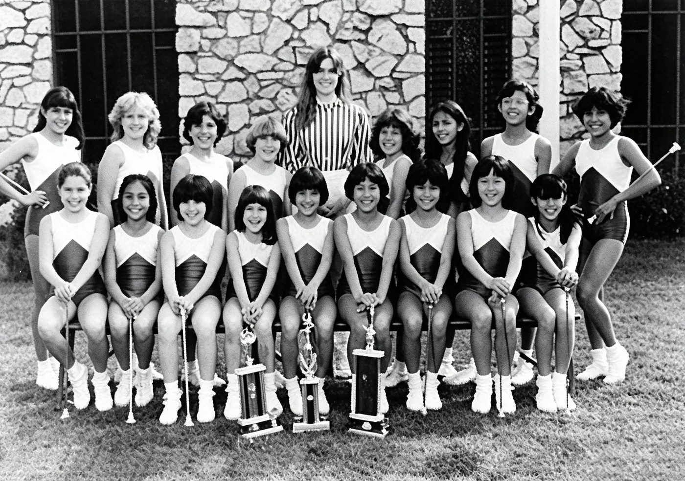 The South Hills Academy drill team with rows of trophies